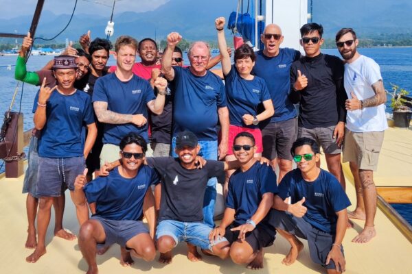 Happy divers celebrating the end of a Konjo-led Wild Banda Sea Expedition in Indonesia.